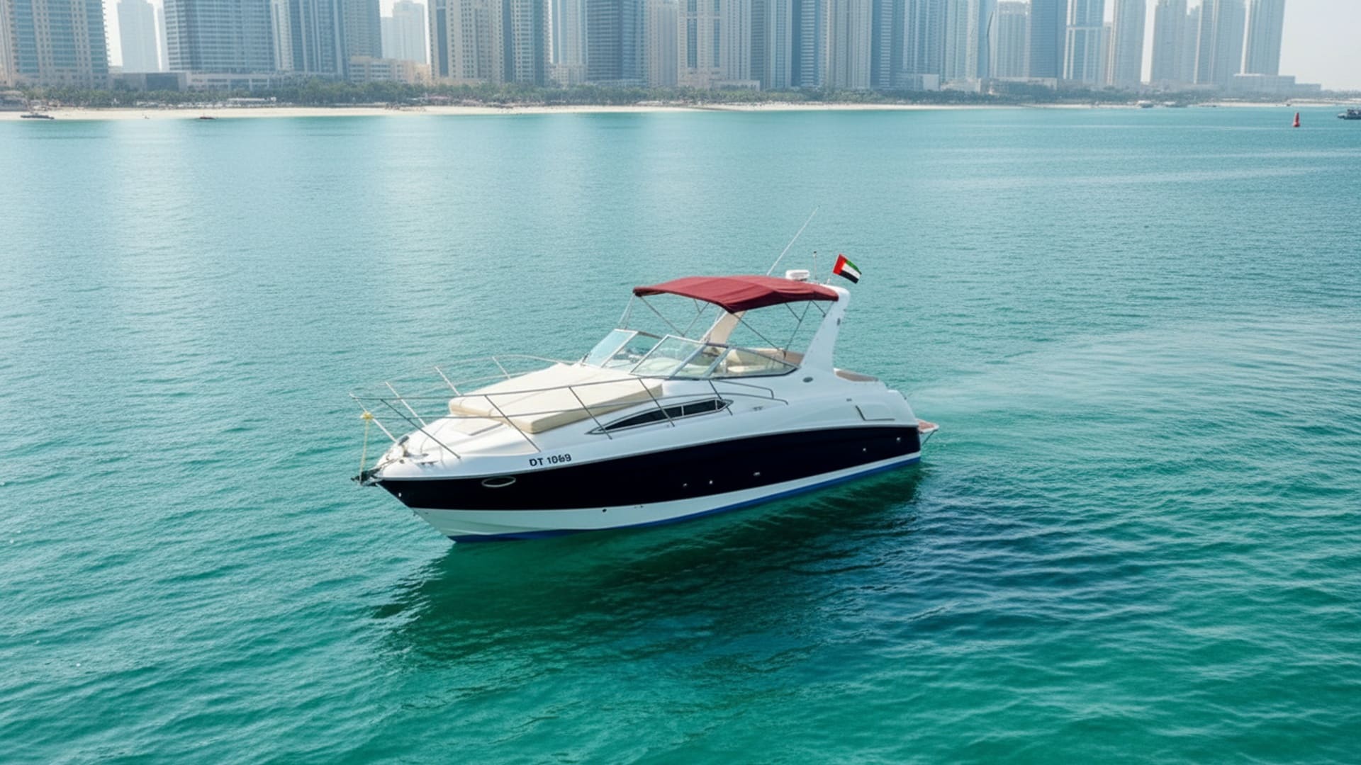 Aerial view of Sunrise Legend 33 ft cruising Dubai Marina